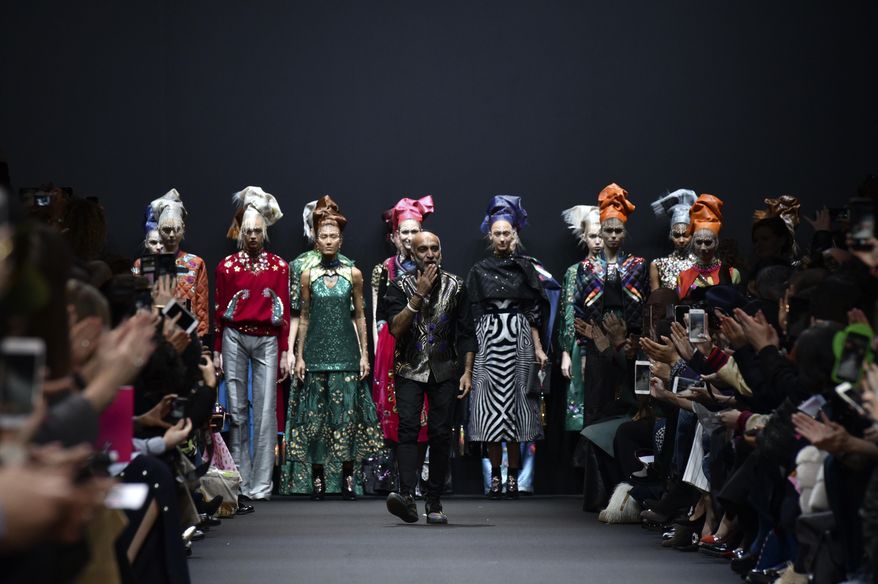 Indian fashion designer Manish Arora blows a kiss to the audience after his Fall-Winter 2017-2018 ready to wear fashion collection presented Thursday, March 2, 2017 in Paris. (AP Photo/Zacharie Scheurer)