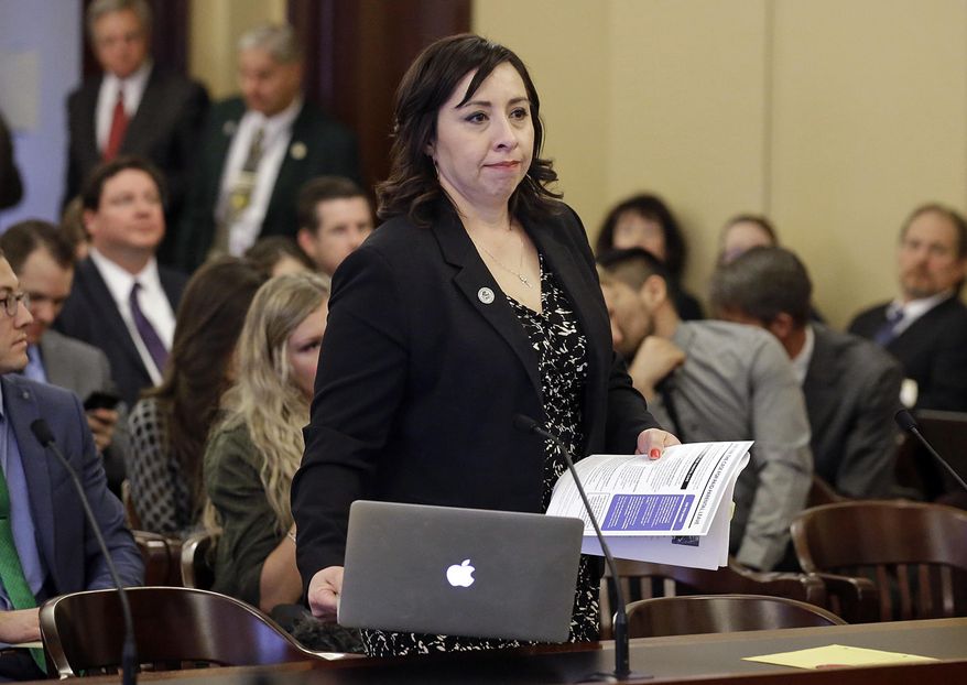 FILE - In this Feb. 18, 2016 file photo, Salt Lake City Democrat Rep. Angela Romero prepares to testify at the state Capitol, in Salt Lake City. Utah lawmakers on Thursday, March 2, 2017, were expected to consider a bill requiring college counselors to keep sexual abuse reports confidential, almost one year after Mormon-owned Brigham Young University faced major backlash when it was revealed it shared assault victim information with its honor code office. The proposal by Romero, would also apply to student reports of domestic violence, sexual harassment and dating violence and was scheduled for review by a Senate law enforcement committee. (AP Photo/Rick Bowmer, File)