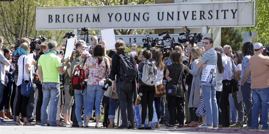 FILE - This April 20, 2016, file photo, protesters stand in solidarity with rape victims on the campus of Brigham Young University during a sexual assault awareness demonstration, in Provo, Utah. Utah lawmakers on Thursday, March 2, 2017, were expected to consider a bill requiring college counselors to keep sexual abuse reports confidential, almost one year after Mormon-owned Brigham Young University faced major backlash when it was revealed it shared assault victim information with its honor code office. The proposal by Romero, would also apply to student reports of domestic violence, sexual harassment and dating violence and was scheduled for review by a Senate law enforcement committee. (AP Photo/Rick Bowmer, File)