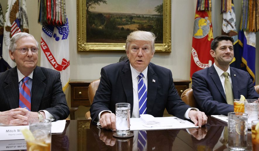 President Donald Trump, flanked by Senate Majority Leader Mitch McConnell of Ky. and House Speaker Paul Ryan of Wis., hosts a meeting with House and Senate leadership, Wednesday, March 1, 2017, in the Roosevelt Room of the White House in Washington. (AP Photo/Evan Vucci)
