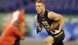 Stanford running back Christian McCaffrey runs a drill at the NFL football scouting combine in Indianapolis, Friday, March 3, 2017. (AP Photo/Michael Conroy)