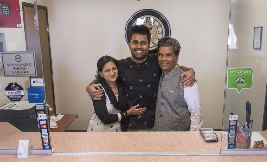 ADVANCE FOR THE WEEKEND OF MARCH 4-5 AND THEREAFTER - In a Feb. 21, 2017 photo, Kunal, Sarita and Ken Sah are reunited again at the hotel they built in 2001 after living some 10 years apart. Kunal's parents, Ken and Sarita Sah, were forced to leave the country in 2006 after losing their legal battle with U.S. Immigration authorities. Kunal has been running the family's hotel business in Green River since 2011, trying to keep his parents' dream alive without them.  (Leah Hogsten/The Salt Lake Tribune via AP)