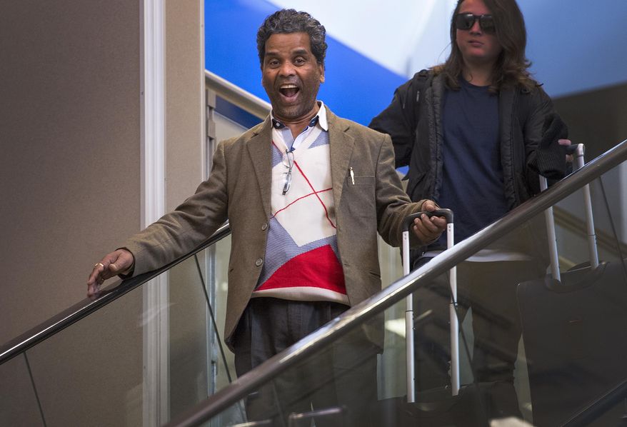 ADVANCE FOR THE WEEKEND OF MARCH 4-5 AND THEREAFTER - In a Feb. 21, 2017 photo, even after 30 hours of travel, Ken Sah's face lights up at seeing his wife, son and grandson after the three are reunited in the U.S. for the first time in over 10 years at the Salt Lake International Airport. Sarita Sah arrived in Utah three weeks ago, ahead of her husband. Ken and Sarita, were forced to leave the country in 2006 after losing their legal battle with U.S. Immigration authorities. Their son Kunal has been running the family's hotel business in Green River since 2011, trying to keep his parents' dream alive without them. (Leah Hogsten/The Salt Lake Tribune via AP)