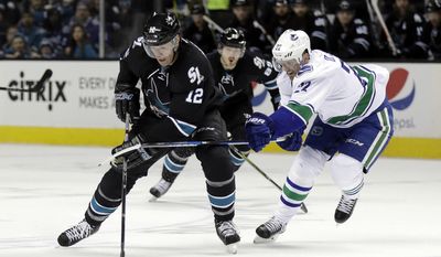 San Jose Sharks&#39; Patrick Marleau (12) is defended by Vancouver Canucks&#39; Daniel Sedin (22) during the first period of an NHL hockey game Thursday, March 2, 2017, in San Jose, Calif. (AP Photo/Marcio Jose Sanchez)
