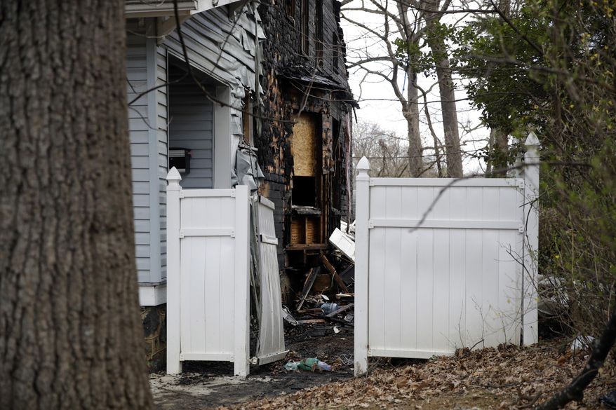 Damage is seen on a house where a fatal fire occurred overnight in Baltimore, Friday, March 3, 2017, where officials say two people died and four people were critically injured. (AP Photo/Patrick Semansky)