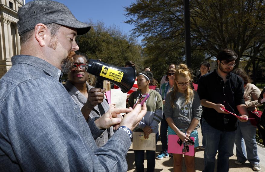 Pastor Matt McGue of One Church, reads a letter from 22-year old Daniela Vargas, a Argentine native who has lived in the United States since she was seven years old, and was detained March 1, by immigration agents who state that she is a "unlawfully present Argentinian citizen" during a "targeted immigration enforcement action," during a brief rally on her behalf, at the Capitol in Jackson, Miss., Friday, March 3, 2017. (AP Photo/Rogelio V. Solis)