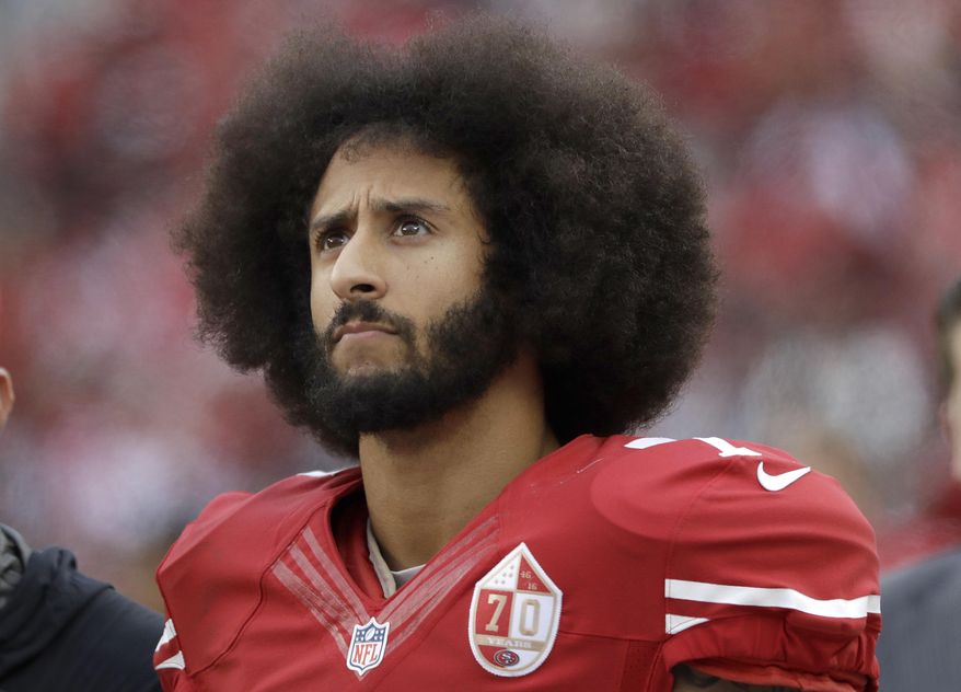 In this Dec. 11, 2016, file photo, San Francisco 49ers quarterback Colin Kaepernick stands in the bench area during the second half of the team's NFL football game against the New York Jets in Santa Clara, Calif. (AP Photo/Marcio Jose Sanchez, File)