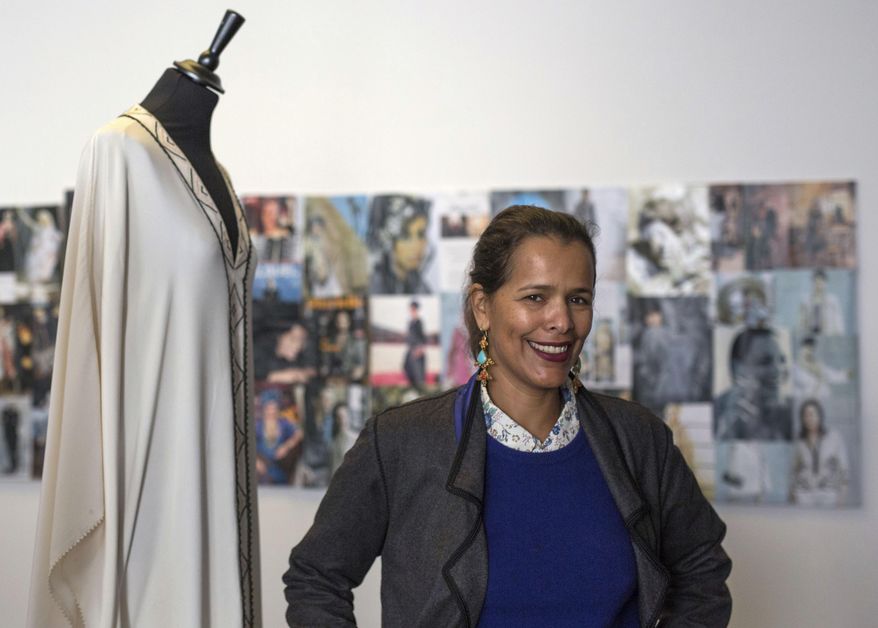 In this photo dated Tuesday, Feb. 28, 2017, Moroccan fashion designer Fadila El Gadi poses for a portrait in her showroom in Sale, near Rabat, Morocco. A globally successful Moroccan fashion designer returned to her hometown and founded an unusual sewing school aimed at helping poor, troubled children find a path, in a country where youth unemployment is high and the lure of extremism lurks. (AP Photo/Mosa'ab Elshamy)