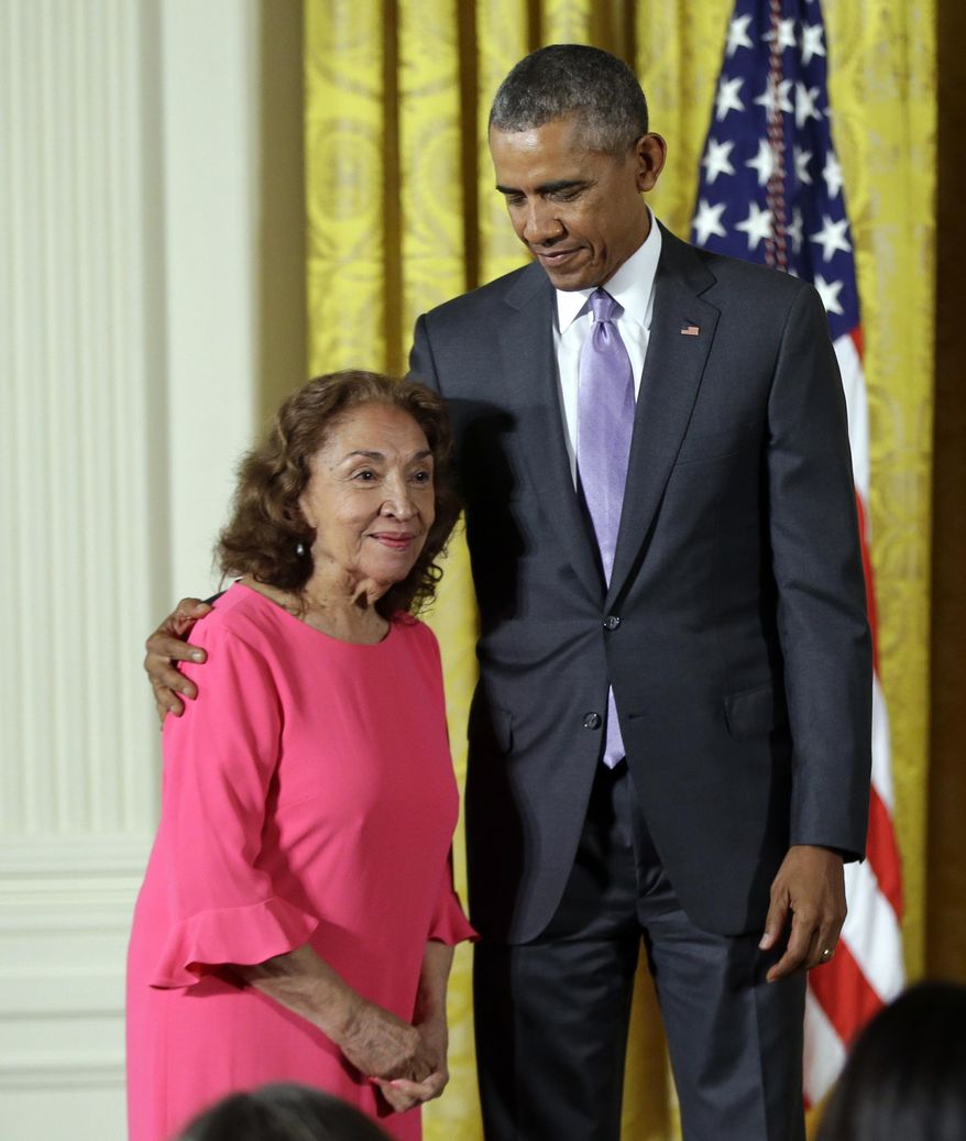 FILE - In this Sept. 10, 2015, file photo, President Barack Obama awards the 2014 National Medal of Arts to actress, theater founder, and director Miriam Colon of New York, during a ceremony in the East Room at the White House in Washington. Colon, an icon in U.S. Latino theater who starred in films alongside Marlon Brando and Al Pacino, has died at age 80. Her husband, Fred Valle, told The Associated Press that Colon died early Friday, March 3, 2017, because of complications from a pulmonary infection. (AP Photo/Manuel Balce Ceneta, file)