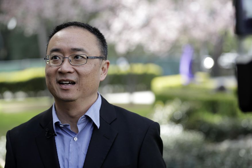 St. Francis High School president Simon Chiu conducts an interview Friday, March 3, 2017, in Mountain View, Calif. The red-hot IPO debut of vanishing-photo superstar Snap this week not only placed the Southern California startup at a $35 billion value. It also made Mountain View, Calif.'s Saint Francis high school $23 million richer. The Catholic school had invested $15,000 in Snap's early round of funding way back in 2012. By the time shares in Snap had finished trading Thursday afternoon, that pittance had turned into a big fat pile of shareholder value. (AP Photo/Marcio Jose Sanchez)