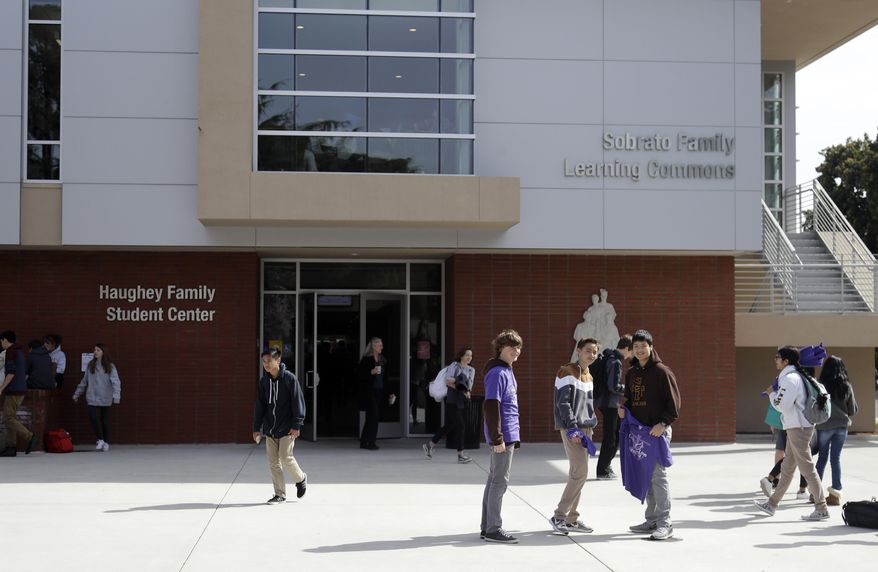 Students are seen at St. Francis High School Friday, March 3, 2017, in Mountain View, Calif. The red-hot IPO debut of vanishing-photo superstar Snap this week not only placed the Southern California startup at a $35 billion value. It also made Mountain View, Calif.'s Saint Francis high school $23 million richer. The Catholic school had invested $15,000 in Snap's early round of funding way back in 2012. By the time shares in Snap had finished trading Thursday afternoon, that pittance had turned into a big fat pile of shareholder value. (AP Photo/Marcio Jose Sanchez)