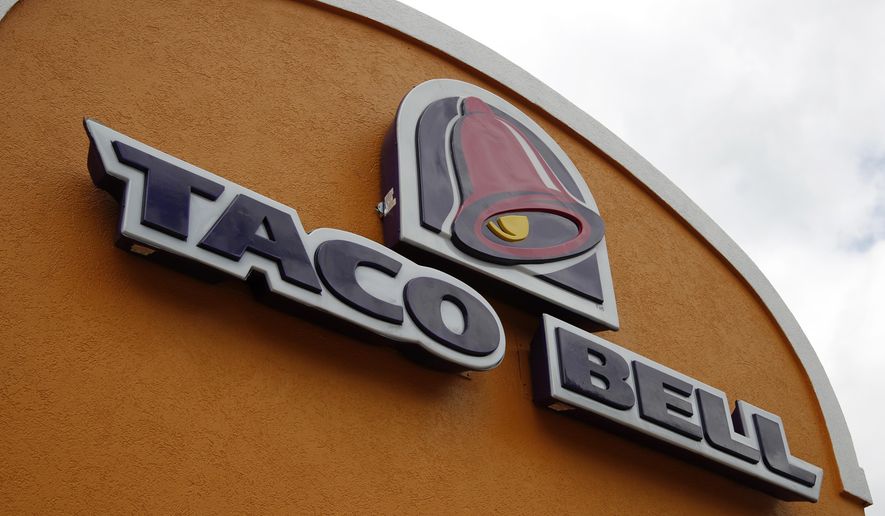FILE - This Friday, May 23, 2014, file photo shows a sign at a Taco Bell in Mount Lebanon, Pa. The chain's "Love and Tacos" contest offers couples the chance to win an all-expense paid trip to Las Vegas to get married in a chapel at the chain’s flagship restaurant. The winner will be announced March 16, 2017. (AP Photo/Gene J. Puskar, File)