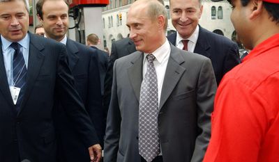 FILE - In this Sept. 26, 2003, file photo, Russian President Vladimir Putin, center, and Sen. Charles Schumer D-N.Y., second from right, are escorted through New York&#39;s first Lukoil gas station by Lukoil President Vagit Alekperov, left, in New York City. Lukoil is the giant Russian oil company. Putin later traveled to meet with President George W. Bush at the Camp David presidential retreat. President Donald Trump, his administration under siege for contacts with Russian officials, is calling for &amp;quot;an immediate investigation&amp;quot; into Schumer tie&#39;s to Russian Putin. Trump’s evidence? A 14-year-old photo of Schumer and Putin holding coffee and doughnuts in a New York City gas station. (AP Photo/Scout Tufankjian, File)