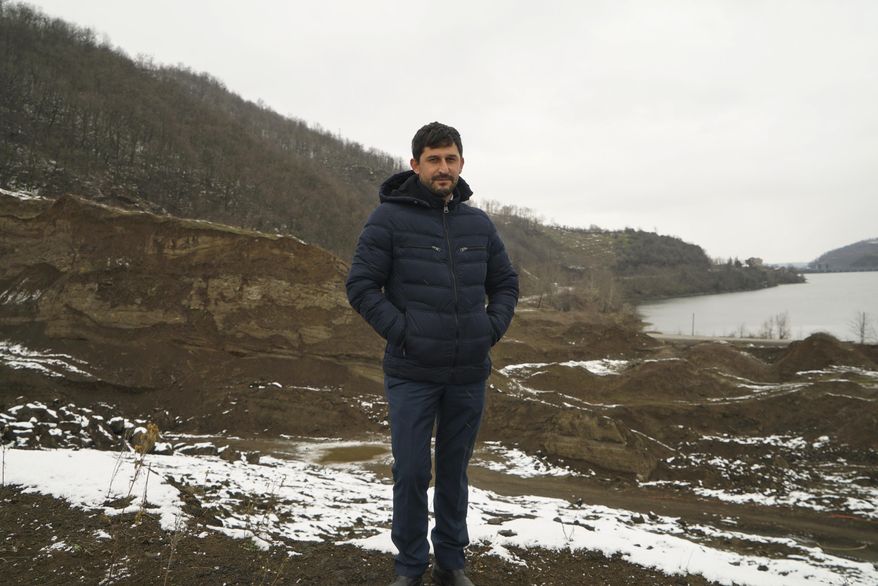 In this Wednesday, Feb. 15, 2017 photo, Hasan Celik, head of the tourism organization, in Turkey's Black Sea region town of Ayvacik, stands near an area where a Saudi investor purchased land. At least four projects to lure visitors from the Gulf region and Arab nations are underway along Turkey's more traditional and conservative Black Sea coastline, where _ unlike Turkey's more popular Mediterranean and Aegean coasts _ residents and visitors opt for full body covering swimsuits and where bars selling alcohol are few and far between. (AP Photo/Neyran Elden)