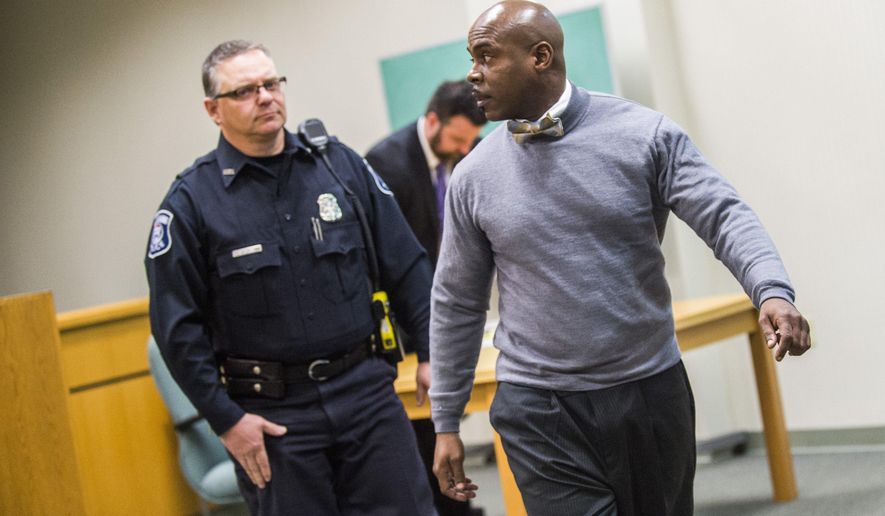 Flint City Councilman Wantwaz Davis glances behind after Flushing District Court Judge David J. Goggins sentenced him to spend 30 days in Genesee County Jail following a guilty plea in his drunken driving case on Friday, March 3, 2017, at the 67th District Court in Flushing. (Jake May /The Flint Journal-MLive.com via AP)