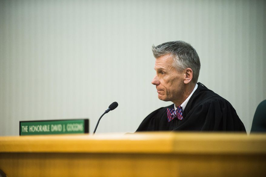 Flushing District Court Judge David J. Goggins sentences Flint City Councilman Wantwaz Davis to spend 30 days in Genesee County Jail following a guilty plea in his drunken driving case on Friday, March 3, 2017, at the 67th District Court in Flushing, Mich. (Jake May /The Flint Journal-MLive.com via AP)