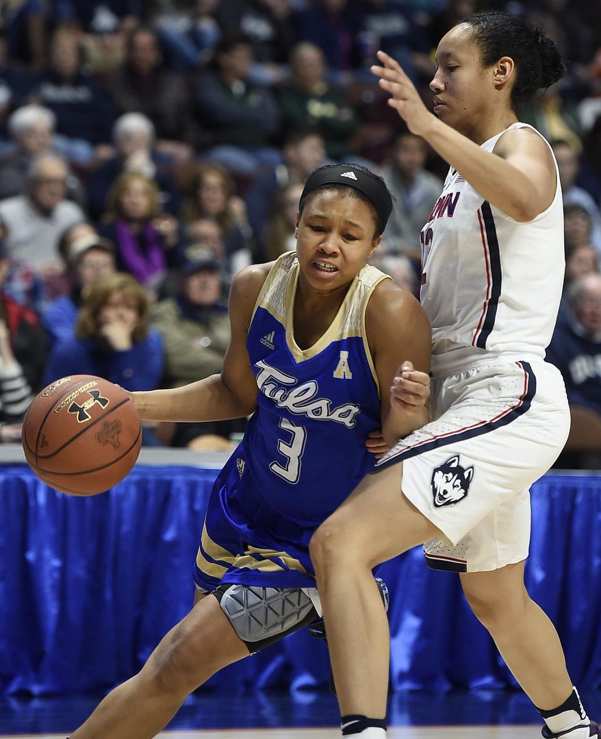 Tulsa&#39;s Erika Wakefield, left, drives around Connecticut&#39;s Saniya Chong, right, during the second half of an NCAA college basketball game in the American Athletic Conference tournament quarterfinals at Mohegan Sun Arena, Saturday, March 4, 2017, in Uncasville, Conn. (AP Photo/Jessica Hill)