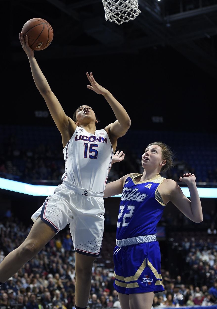Connecticut&#39;s Gabby Williams shoots over Tulsa&#39;s Jessica Pongonis, right, during the first half of an NCAA college basketball game in the American Athletic Conference tournament quarterfinals at Mohegan Sun Arena, Saturday, March 4, 2017, in Uncasville, Conn. (AP Photo/Jessica Hill)
