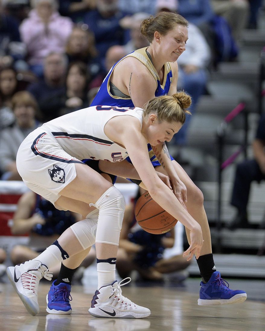Connecticut&#39;s Katie Lou Samuelson, left, chases down a loose ball against Tulsa&#39;s Jessica Pongonis, back, during the first half of an NCAA college basketball game in the American Athletic Conference tournament quarterfinals at Mohegan Sun Arena, Saturday, March 4, 2017, in Uncasville, Conn. (AP Photo/Jessica Hill)