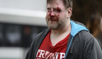 A Trump supporter was injured in a rally last month that attracted hundreds of pro-Trump supporters and opponents near the University of California, Berkeley. (Associated Press/File)