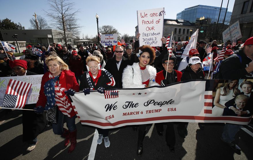 Supporters of President Donald Trump, march from the National Mall to the White House during a rally organized by the North Carolina-based group Gays for Trump, Saturday, March 4, 2017. The speakers at the rally talked about immigration, gay rights, and several other issues. (AP Photo/Manuel Balce Ceneta)