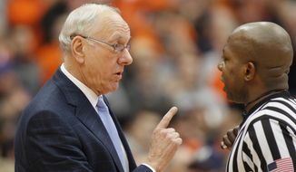 Syracuse head coach Jim Boeheim, left, talks with official Clarence Armstrong, right, in the first half of an NCAA college basketball game against Georgia Tech in Syracuse, N.Y., Saturday, March 4, 2017. (AP Photo/Nick Lisi)