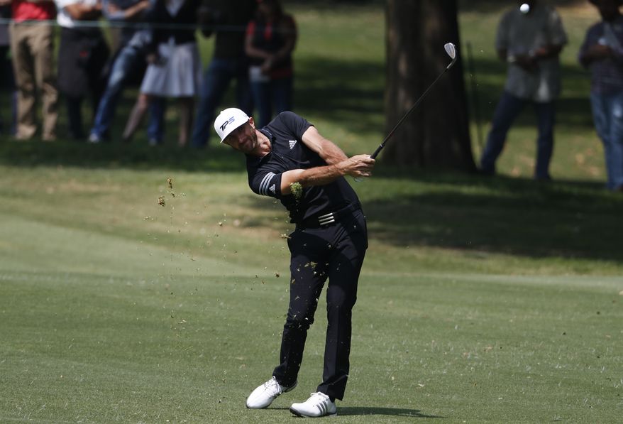 Dustin Johnson of the U.S. hits a ball on the 1st hole in round three of the Mexico Championship at Chapultepec Golf Club in Mexico City, Saturday, March 4, 2017. All but one of the world's top 50 golfers are contesting the World Golf Championship PGA event, which this year relocated to Mexico City from the Trump National Doral Resort in Florida. (AP Photo/Eduardo Verdugo)