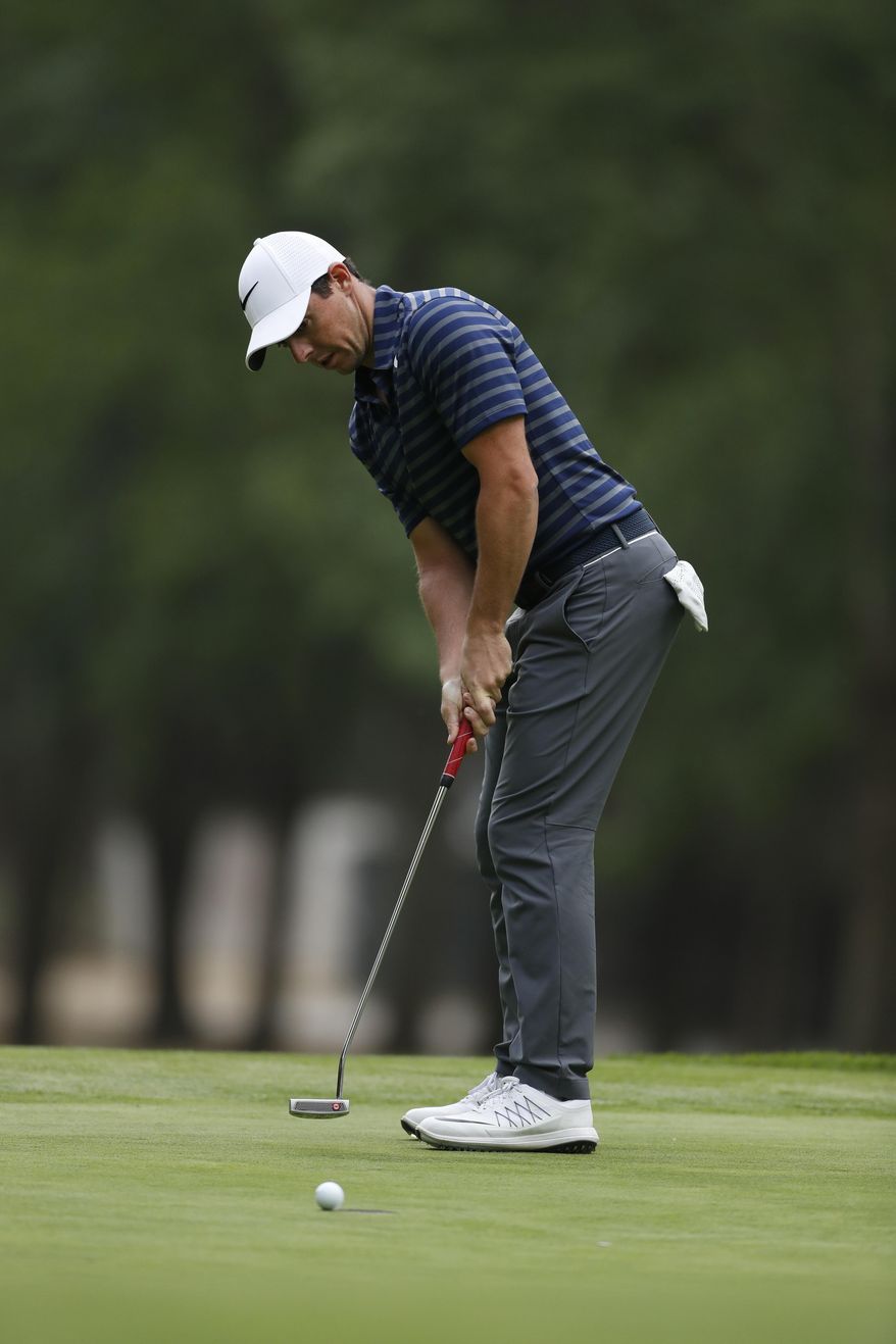 Rory McIlroy, of Northern Ireland, putts the ball on the 17th hole green in round two of the Mexico Championship at Chapultepec Golf Club in Mexico City, Friday, March 3, 2017. All but one of the world's top 50 golfers are contesting the World Golf Championship PGA event, which this year relocated to Mexico City from the Trump National Doral Resort in Florida. (AP Photo/Eduardo Verdugo)