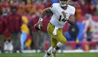 FILE - In this Nov. 26, 2016, file photo, Notre Dame quarterback DeShone Kizer runs the ball during the team&#39;s NCAA college football game against Southern California in Los Angeles. Kizer finds himself in good company at the NFL combine in what is generally described as an unusually uninspiring crop of quarterbacks. None of the prospects are currently in the discussion to go No. 1 overall. It’s unclear whether any will even go in the top 10. And all of the prospects in town appear to have something to prove. After Kizer led his injury-plagued team into playoff contention in 2015, his first season as the starter, the Fighting Irish went 4-8 in his second season. Suddenly, the prototypically sized, strong-armed Kizer was being viewed as a flawed player with significant questions. (AP Photo/Mark J. Terrill, File)