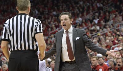 Louisville&#39;s head coach Rick Pitino argues a call with a game official during the first half of an NCAA college basketball game against Notre Dame, Saturday, March 4, 2017, in Louisville, Ky. (AP Photo/Timothy D. Easley)