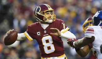 In this Jan. 1, 2017, file photo, Washington Redskins quarterback Kirk Cousins (8) passes during the first half of an NFL football game against the New York Giants in Landover, Md. In a move that seemed the most likely at this point in the odd dance between Kirk Cousins and the Washington Redskins, the team placed the exclusive franchise tag on the starting quarterback on Tuesday. (AP Photo/Nick Wass, File)