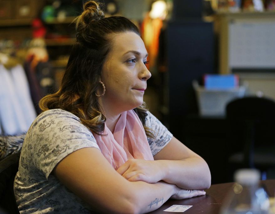 In this photo taken Feb. 27, 2017, Jessica Wolfe talks about her life story as she sits at The Genesis Project, a drop-in center for victims of sex trafficking in SeaTac, Wash. Wolfe, who was forced into sex trafficking shortly after her 19th birthday is now struggling to find housing and a job after background checks find her prostitution convictions, but a measure passed last week in the Washington state Senate could rewrite current law to make it easier for victims of trafficking to vacate prostitution convictions. (AP Photo/Ted S. Warren)