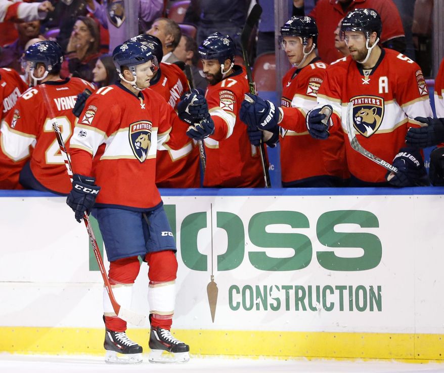 Florida Panthers left wing Jonathan Huberdeau (11) is congratulated by teammates after scoring during the first period of an NHL hockey game against the Dallas Stars, Saturday, March 4, 2017, in Sunrise, Fla. (AP Photo/Wilfredo Lee)