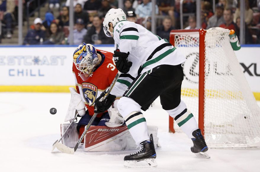 Florida Panthers goalie James Reimer makes a save as Dallas Stars left wing Patrick Sharp attempts a shot during the first period of an NHL hockey game, Saturday, March 4, 2017, in Sunrise, Fla. (AP Photo/Wilfredo Lee)