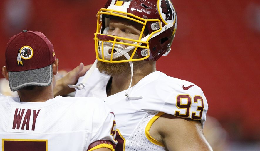Washington Redskins defensive end Trent Murphy (93) speaks with teammate Washington Redskins punter Tress Way (5) before the first half of a preseason NFL football game against the Atlanta Falcons, Thursday, Aug. 11, 2016, in Atlanta. (AP Photo/Brynn Anderson)