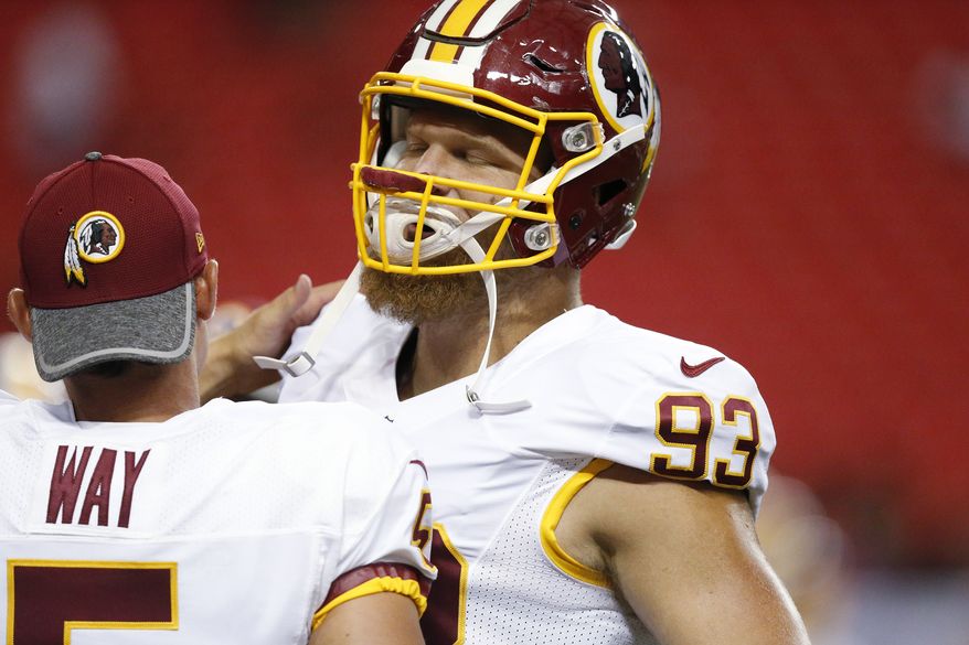 Washington Redskins defensive end Trent Murphy (93) speaks with teammate Washington Redskins punter Tress Way (5) before the first half of a preseason NFL football game against the Atlanta Falcons, Thursday, Aug. 11, 2016, in Atlanta. (AP Photo/Brynn Anderson)