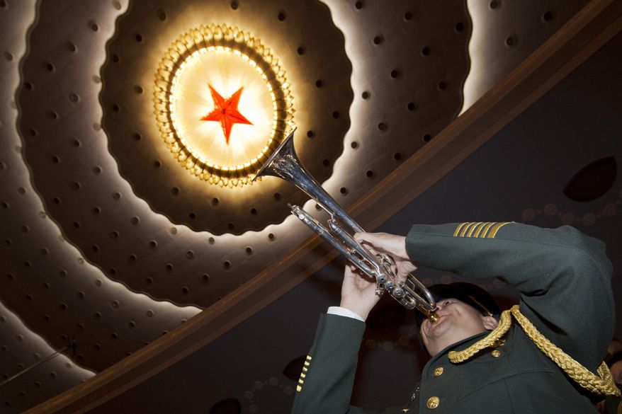 A member of a Chinese military band rehearses before the opening session of the annual National People's Congress at Beijing's Great Hall of the People, Sunday, March 5, 2017. China's top leadership as well as thousands of delegates from around the country are gathered at the Chinese capital for the annual legislature meetings. (AP Photo/Ng Han Guan)
