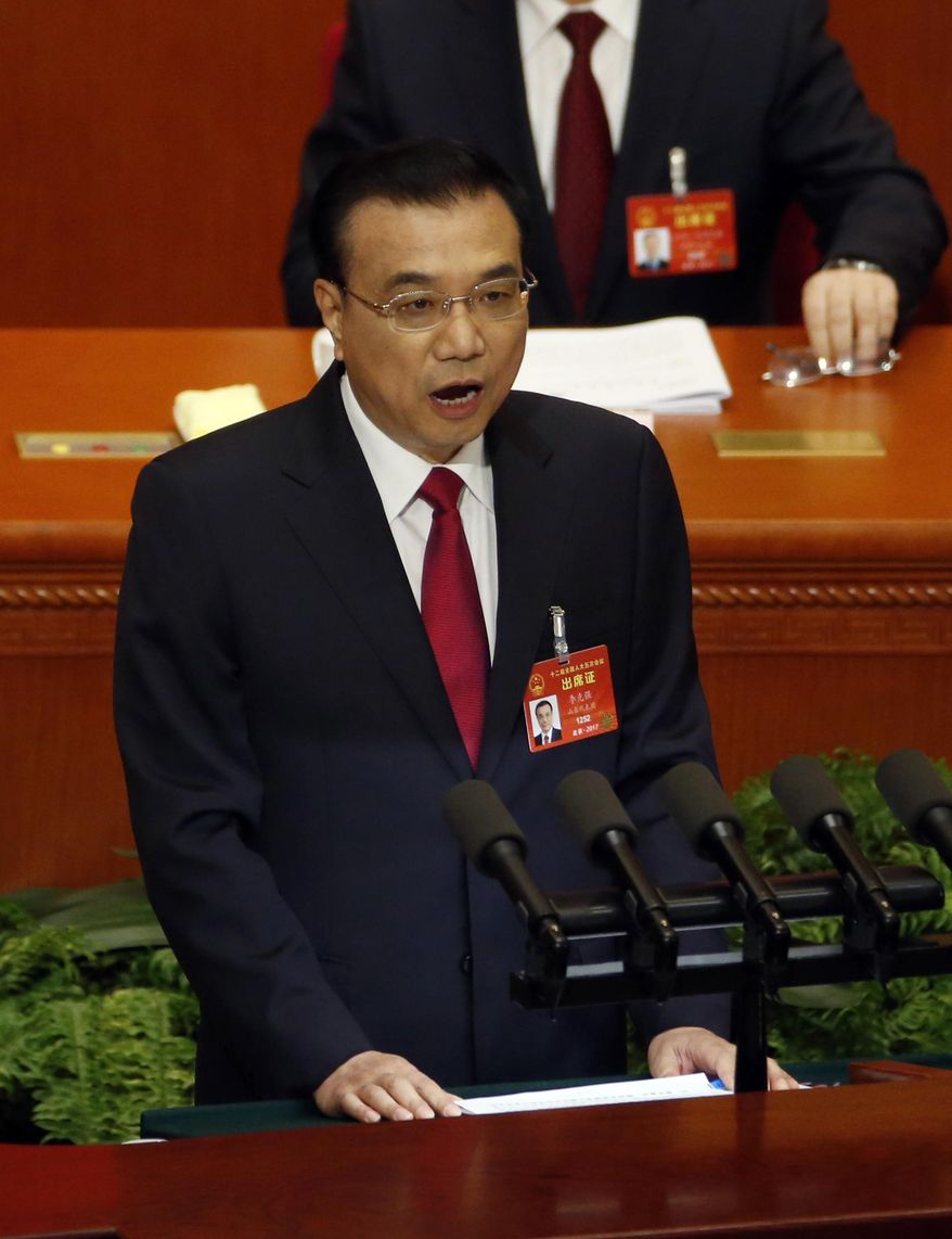Chinese Premier Li Keqiang delivers a work report at the opening session of the annual National People's Congress at Beijing's Great Hall of the People, Sunday, March 5, 2017.China's top leadership as well as thousands of delegates from around the country are gathered at the Chinese capital for the annual legislature meetings. (AP Photo/Ng Han Guan)