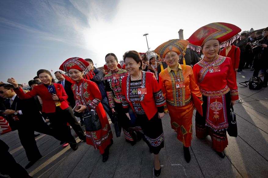 Minority delegates arrive at the Great Hall of the People to attend the opening session of the annual National People's Congress in Beijing, Sunday, March 5, 2017. China's top leadership as well as thousands of delegates from around the country are gathered at the Chinese capital for the annual legislature meetings. (AP Photo/Andy Wong)