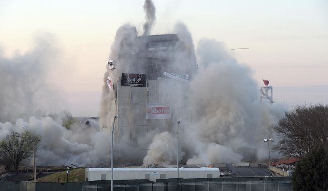 In this file photo, demolition crews bring down the old Georgia state archives building shortly after 7 am Sunday, March 5, 2017, in a controlled implosion, in Atlanta. Meanwhile in Kentucky, Gov. Matt Bevin is auctioning off the right to push the plunger explosives to bring down Frankfort&#x27;s Capital Plaza Tower, with the proceeds benefiting charity. The deadline for bidding is 5 p.m. Eastern on March 10. (Kent D. Johnson/Atlanta Journal-Constitution via AP)
