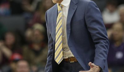 Utah Jazz head coach Quin Snyder calls out instructions to his team during the first half of an NBA basketball game against the Sacramento Kings, Sunday, March 5, 2017, in Sacramento, Calif. (AP Photo/Rich Pedroncelli)