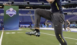 Wisconsin linebacker T.J. Watt stretches at the NFL football scouting combine Sunday, March 5, 2017, in Indianapolis. (AP Photo/David J. Phillip)
