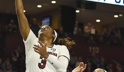 South Carolina guard Kaela Davis (3) shoots as Mississippi State forward Victoria Vivians (35) defends in the first half of an NCAA college basketball game during the Southeastern Conference tournament on Sunday, March 5, 2017, in Greenville, S.C. (AP Photo/Rainier Ehrhardt)
