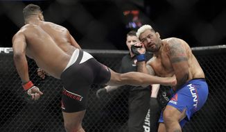 Alistair Overeem kicks Mark Hunt during a heavyweight mixed martial arts bout at UFC 209, Saturday, March 4, 2017, in Las Vegas. (AP Photo/John Locher)
