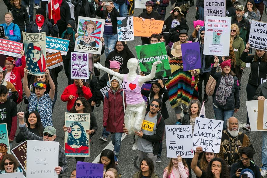 Wednesday's "A Day Without a Woman" is drawing fire as the mass walkout from jobs may harm low-income women. (Associated Press)
