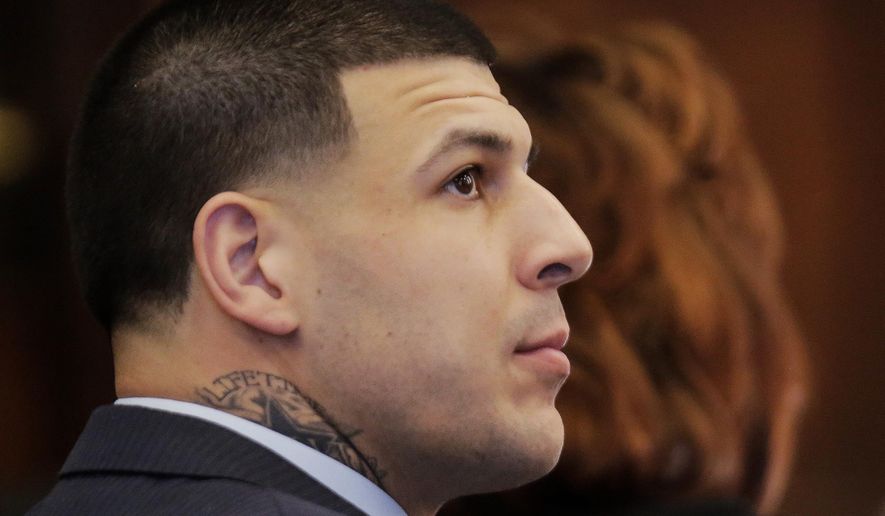 Former New England Patriots tight end Aaron Hernandez watches as defense attorney Ronald Sullivan argues a motion with judge Jeffrey Locke during Hernandez's double murder trial at Suffolk Superior Court on Monday, March 6, 2017, in Boston. Hernandez is standing trial for the July 2012 killings of Daniel de Abreu and Safiro Furtado who he encountered in a Boston nightclub. The former NFL player is already serving a life sentence in the 2013 killing of semi-professional football player Odin Lloyd. (AP Photo/Stephan Savoia, Pool)
