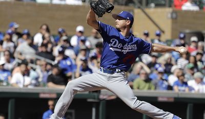 Los Angeles Dodgers' Scott Kazmir throws during the first inning of a spring training baseball game against the Colorado Rockies, Monday, March 6, 2017, in Scottsdale, Ariz. (AP Photo/Darron Cummings)