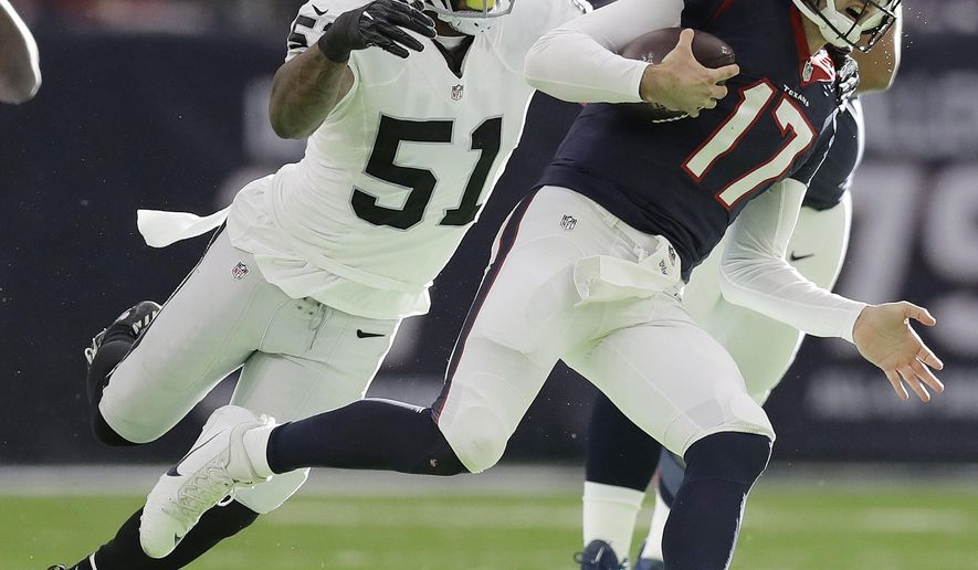 FILE - In this Jan. 7, 2017, file photo, Oakland Raiders outside linebacker Bruce Irvin (51) pursues Houston Texans quarterback Brock Osweiler (17) during the first half of an AFC Wild Card NFL football game, in Houston. Oakland general manager Reggie McKenzie had plenty of youth and needed playoff experience when he went on his spending spree last year. He brought in linebacker Bruce Irvin with two Super Bowl appearances from Seattle to ease the focus on Khalil Mack, and Irvin came through with seven sacks and six forced fumbles. (AP Photo/Eric Gay, File)