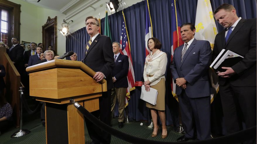 Texas Lt. Gov. Dan Patrick, with other legislators and supporters of Senate Bill 6, talks to the media at the Texas Capitol, Monday, March 6, 2017, in Austin, Texas. The "bathroom bill" would require people to use public bathrooms and restrooms that correspond with the sex on their birth certificate. (AP Photo/Eric Gay)