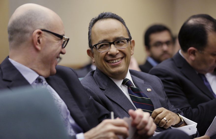 Carlos Gonzalez Gutierrez, center, Mexico's consul general in Austin, waits to give testimony to the Committee on International Trade and Intergovernmental Affairs at the Texas Capitol, Monday, March 6, 2017, in Austin, Texas. Officials from Mexico and Texas are urging the state's lawmakers to defend the North American Free Trade Agreement against President Donald Trump's administration, which has been wary of it. (AP Photo/Eric Gay)